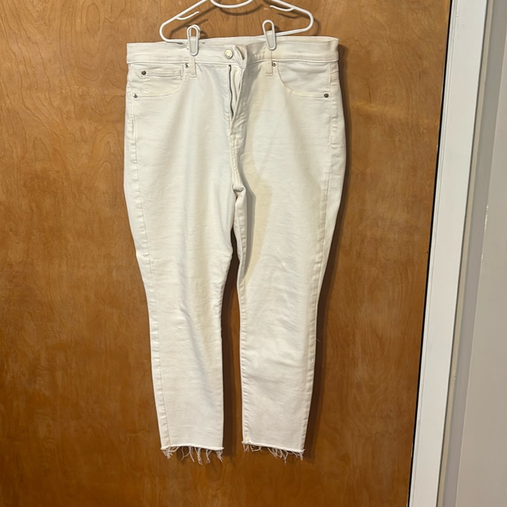 White jeans with distress hem